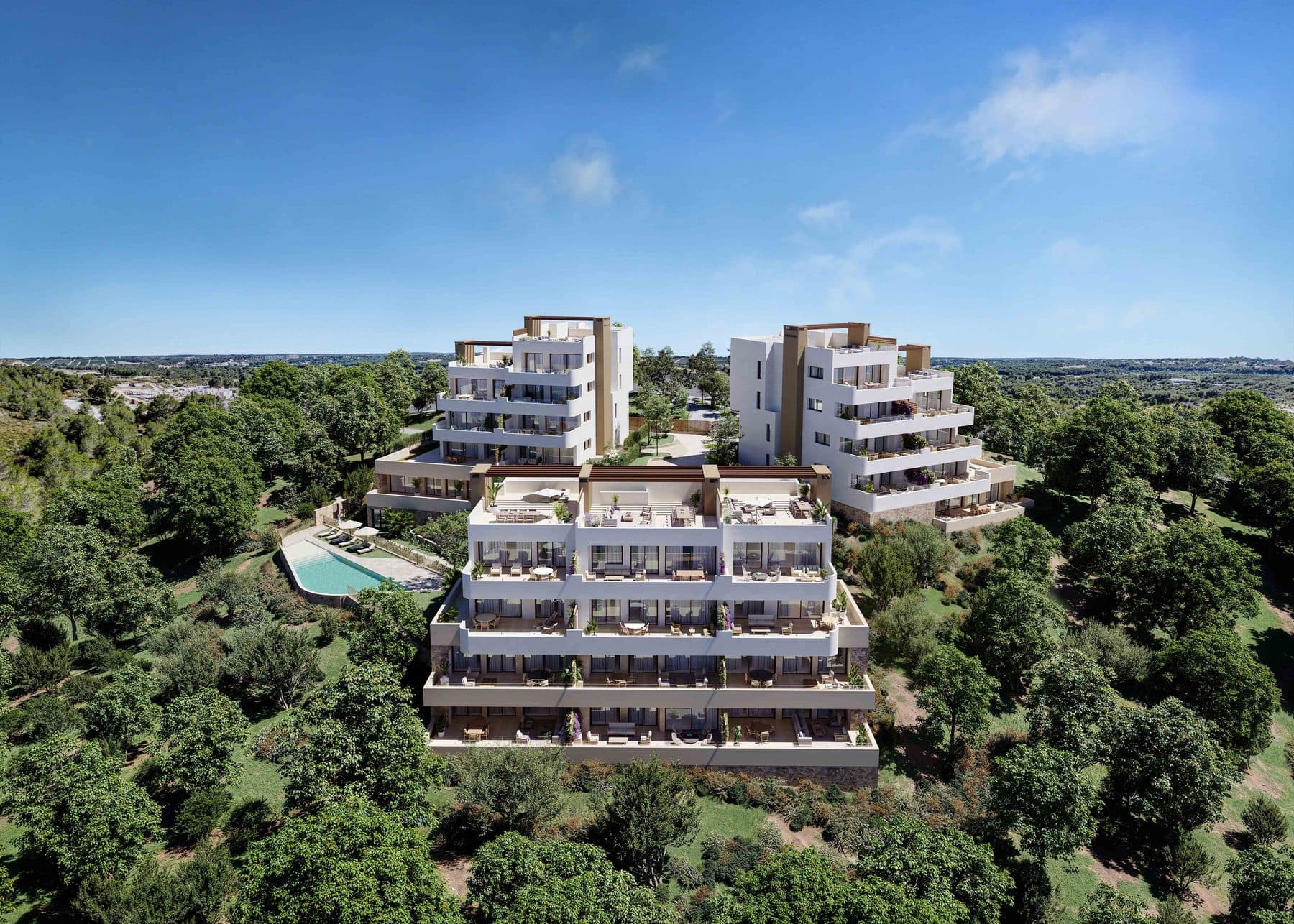 Aerial view of the three Buganvilla Apartments blocks and the shared pool