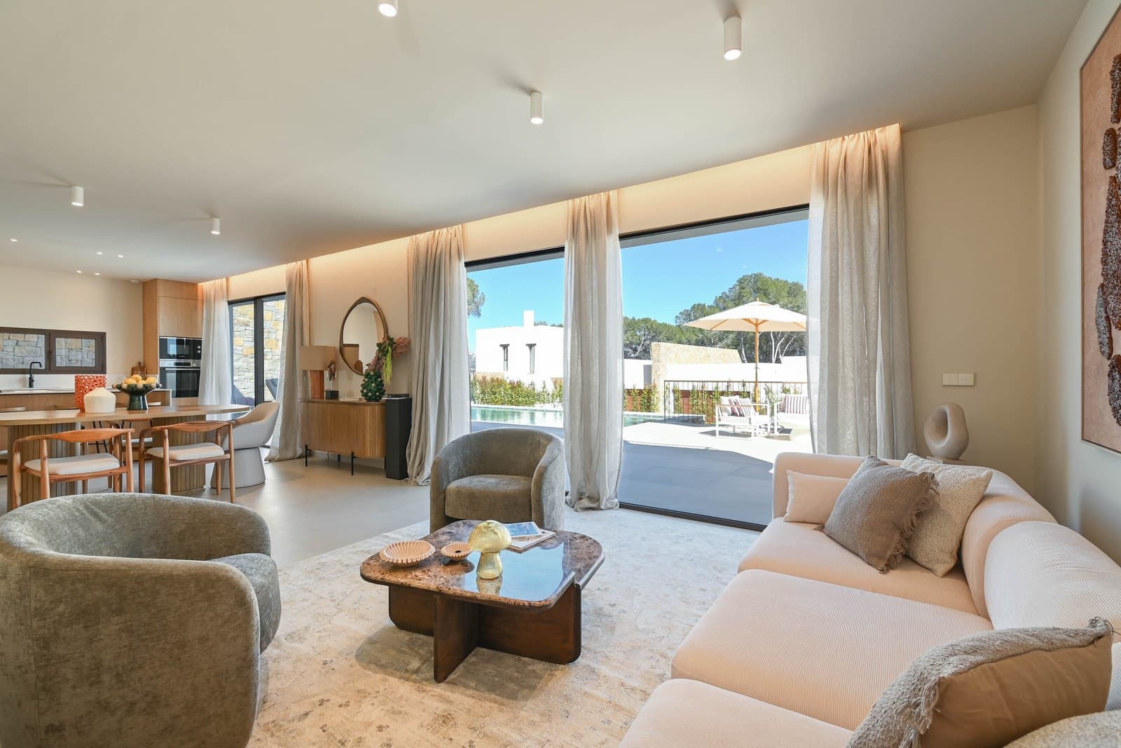 Villa living room opening onto the poolside terrace